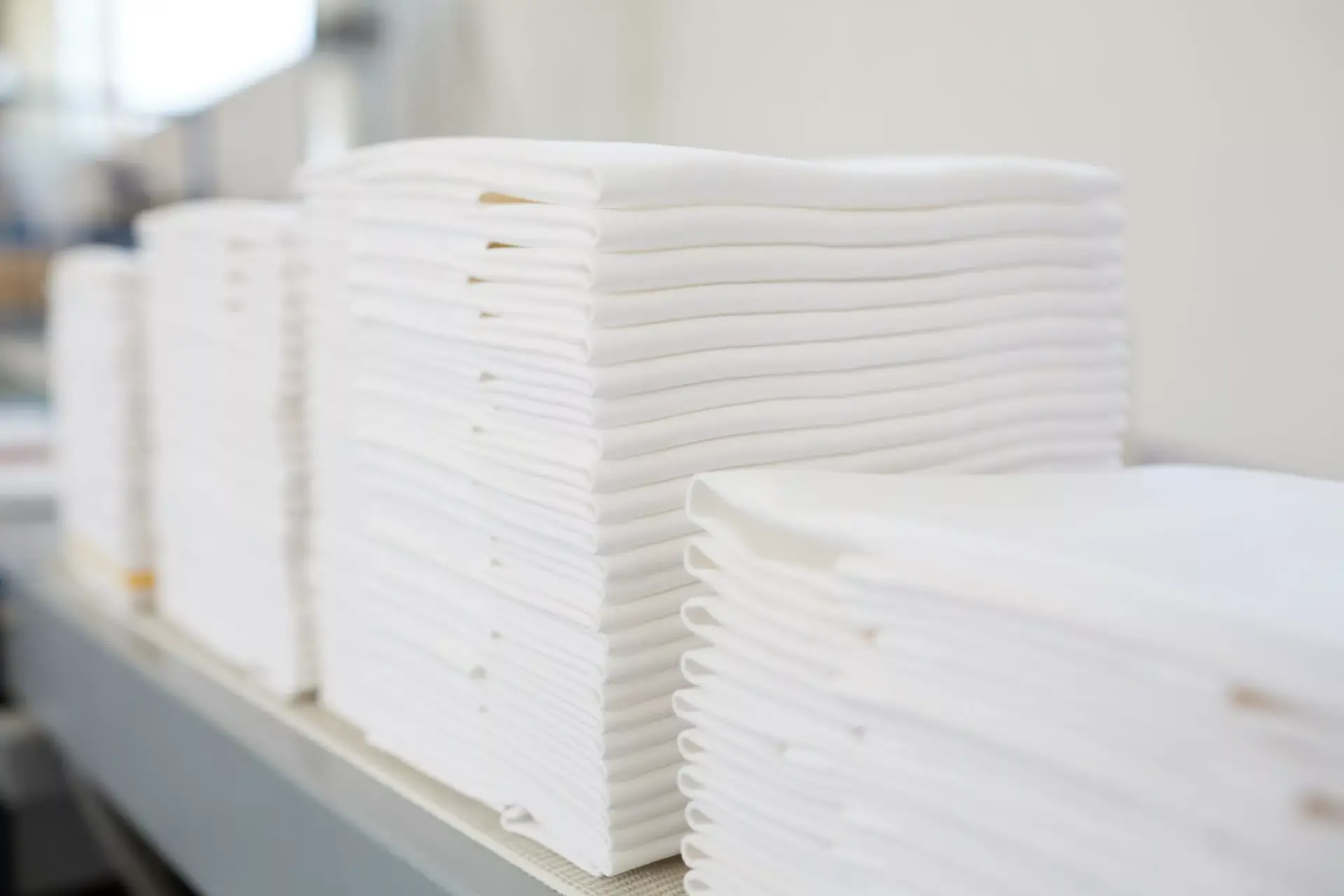 Draps de la Blanchisserie empilés